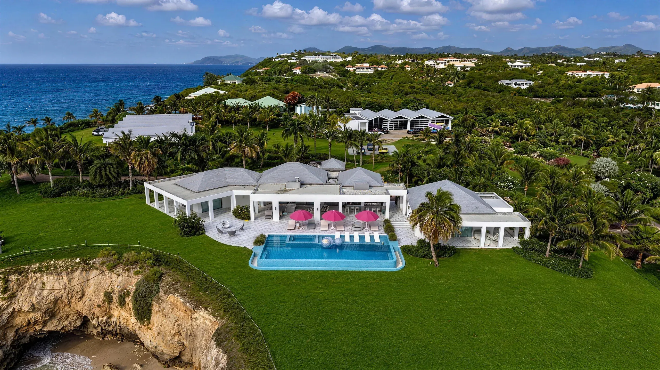 The villa, pool and gardens from behind the estate
