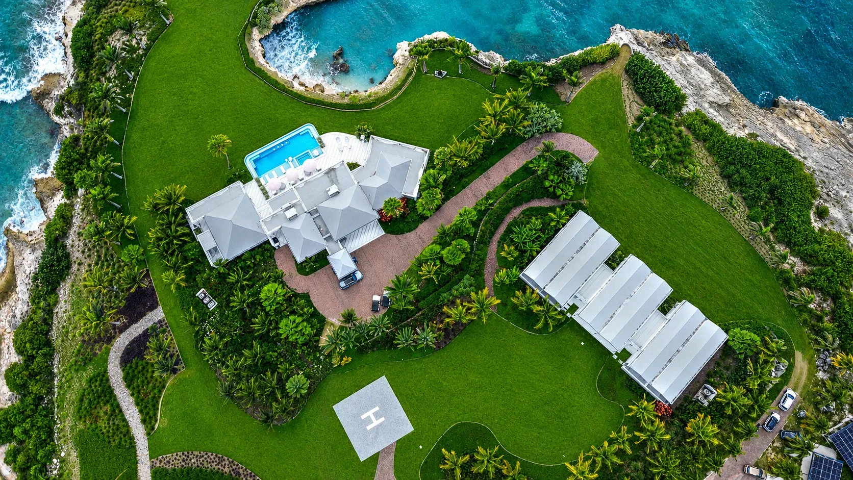 The peninsula from directly above — main house, pavilions and helipad