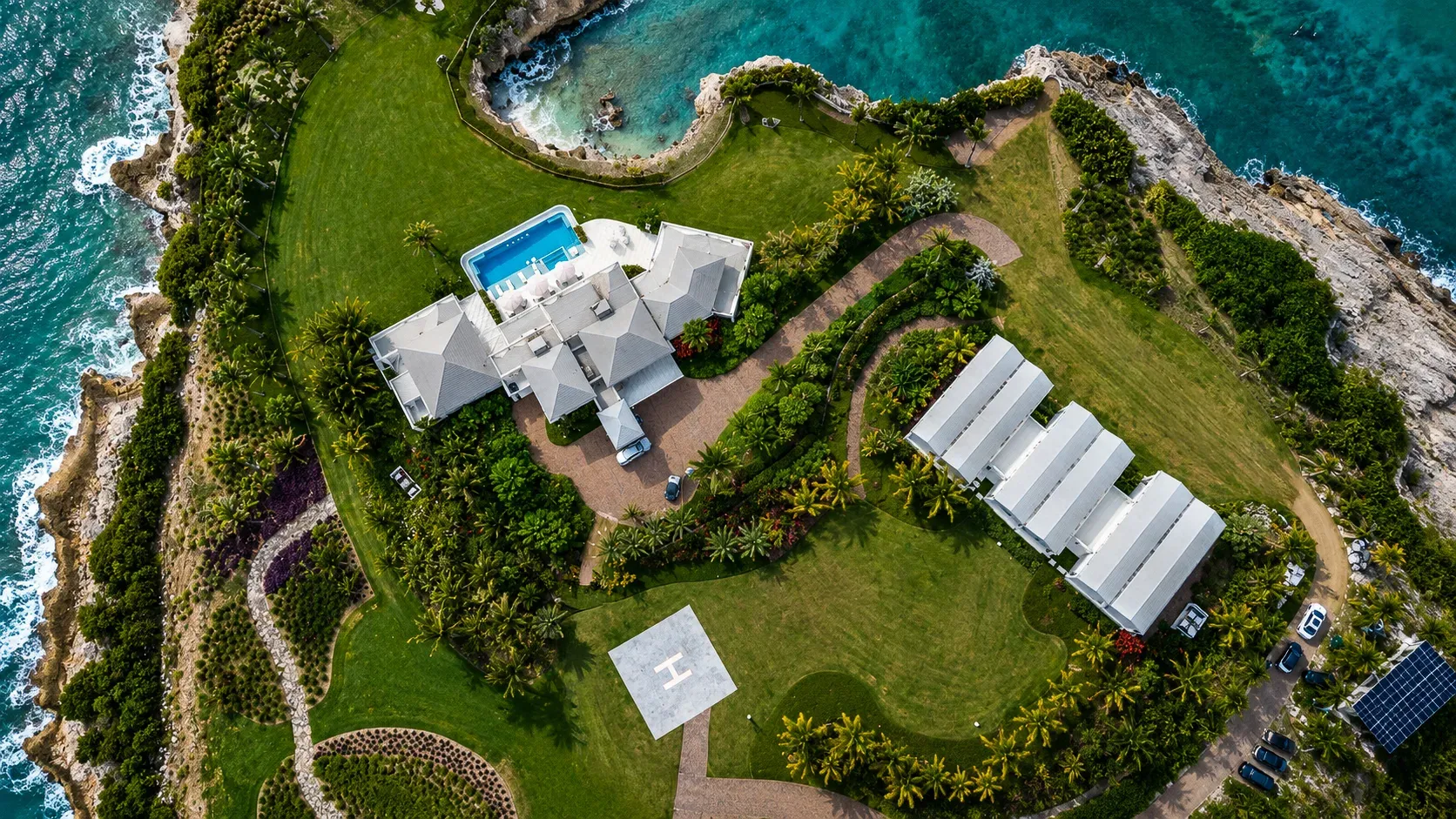 Lawns, gardens and the cove from the air