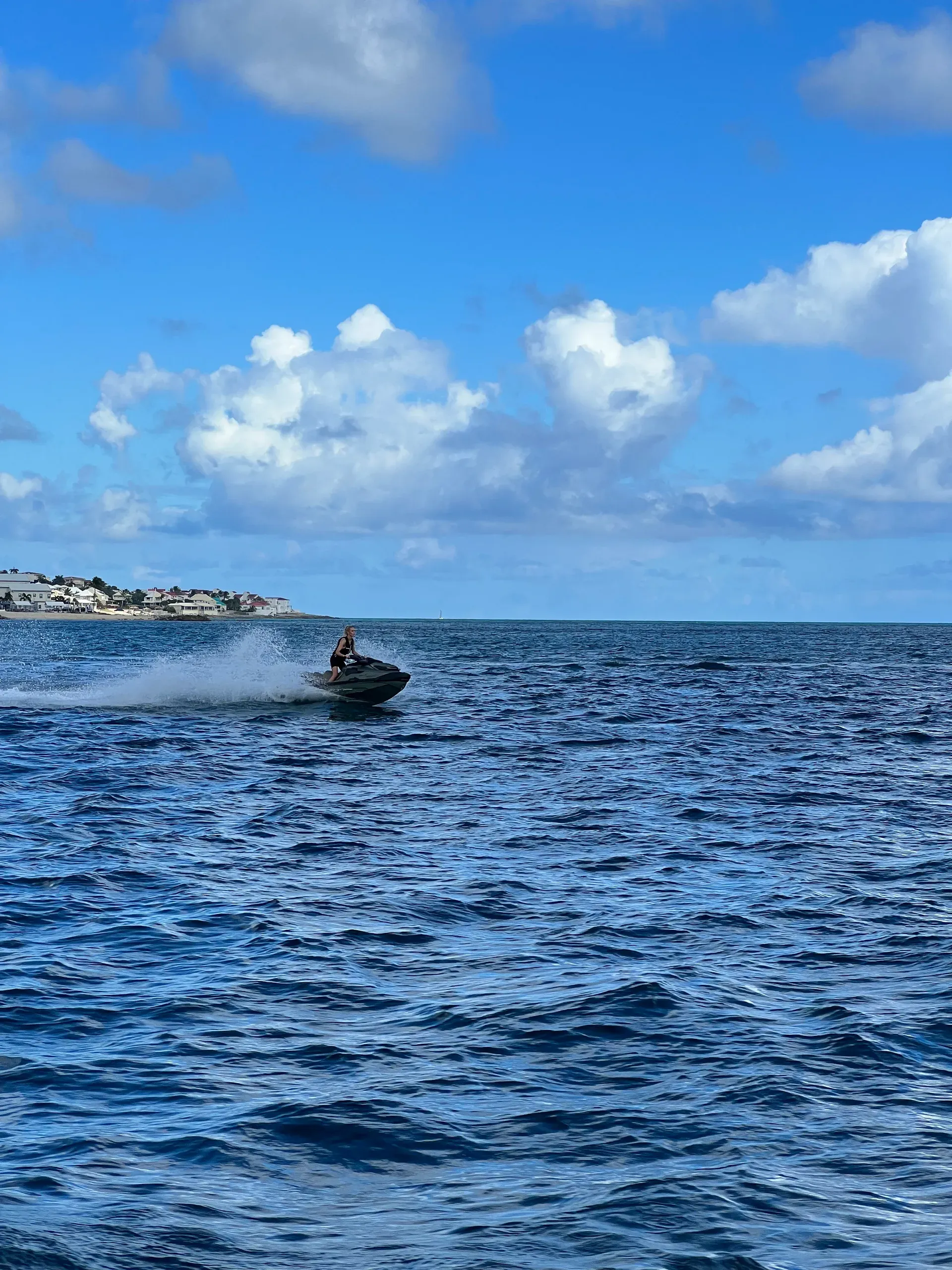A jet ski carving off the estate's waters