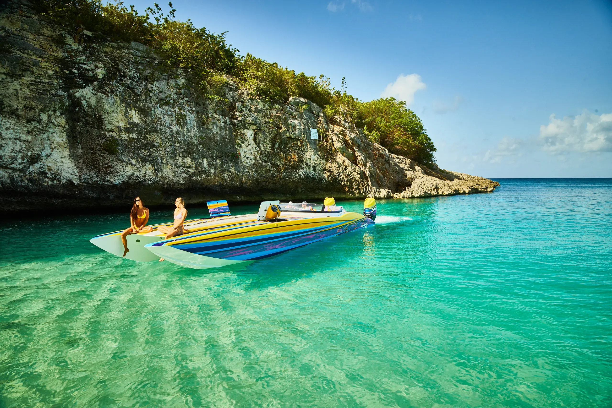 The MTI resting in a quiet cove beneath the cliffs