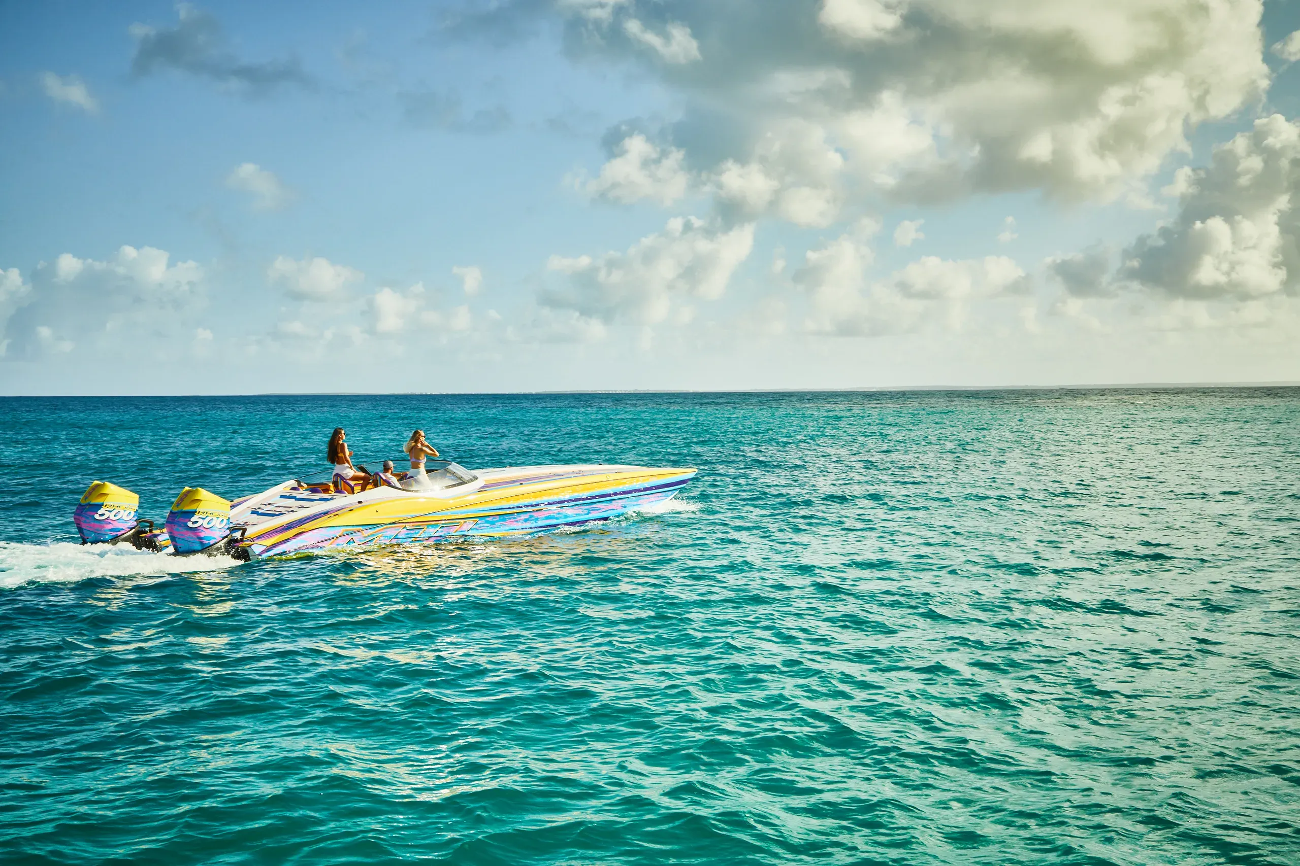 Carving across turquoise water