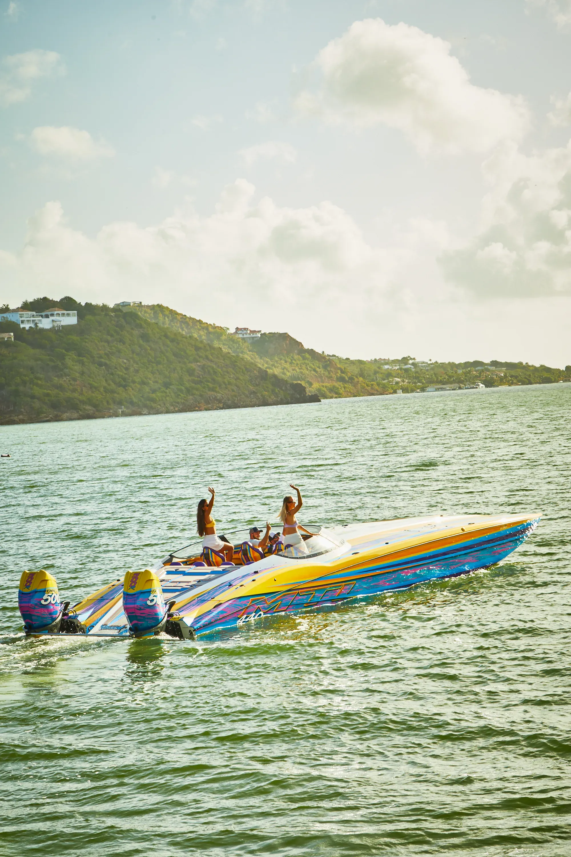 Guests waving from the Speed Boat