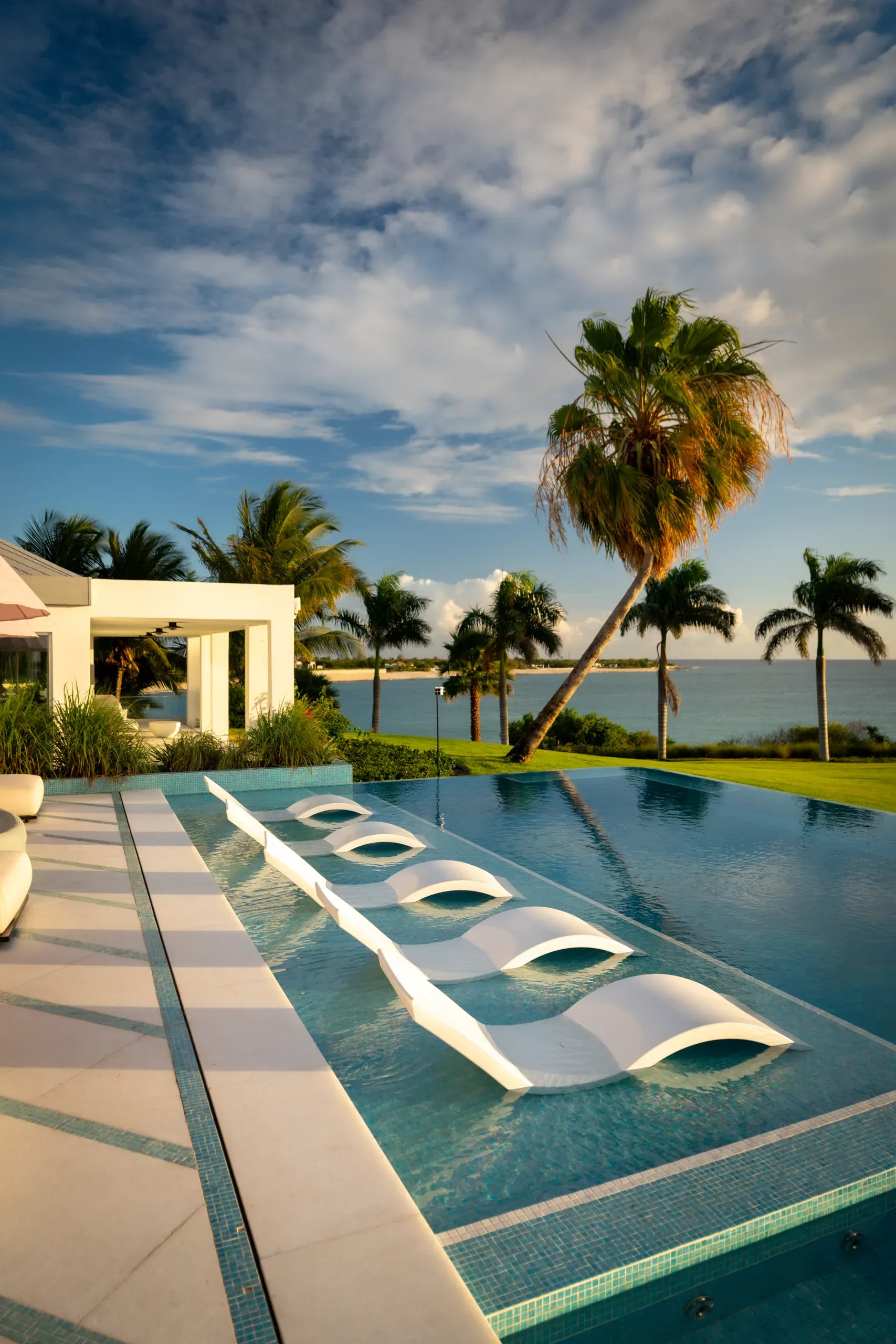 In-pool loungers under a bright Caribbean sky
